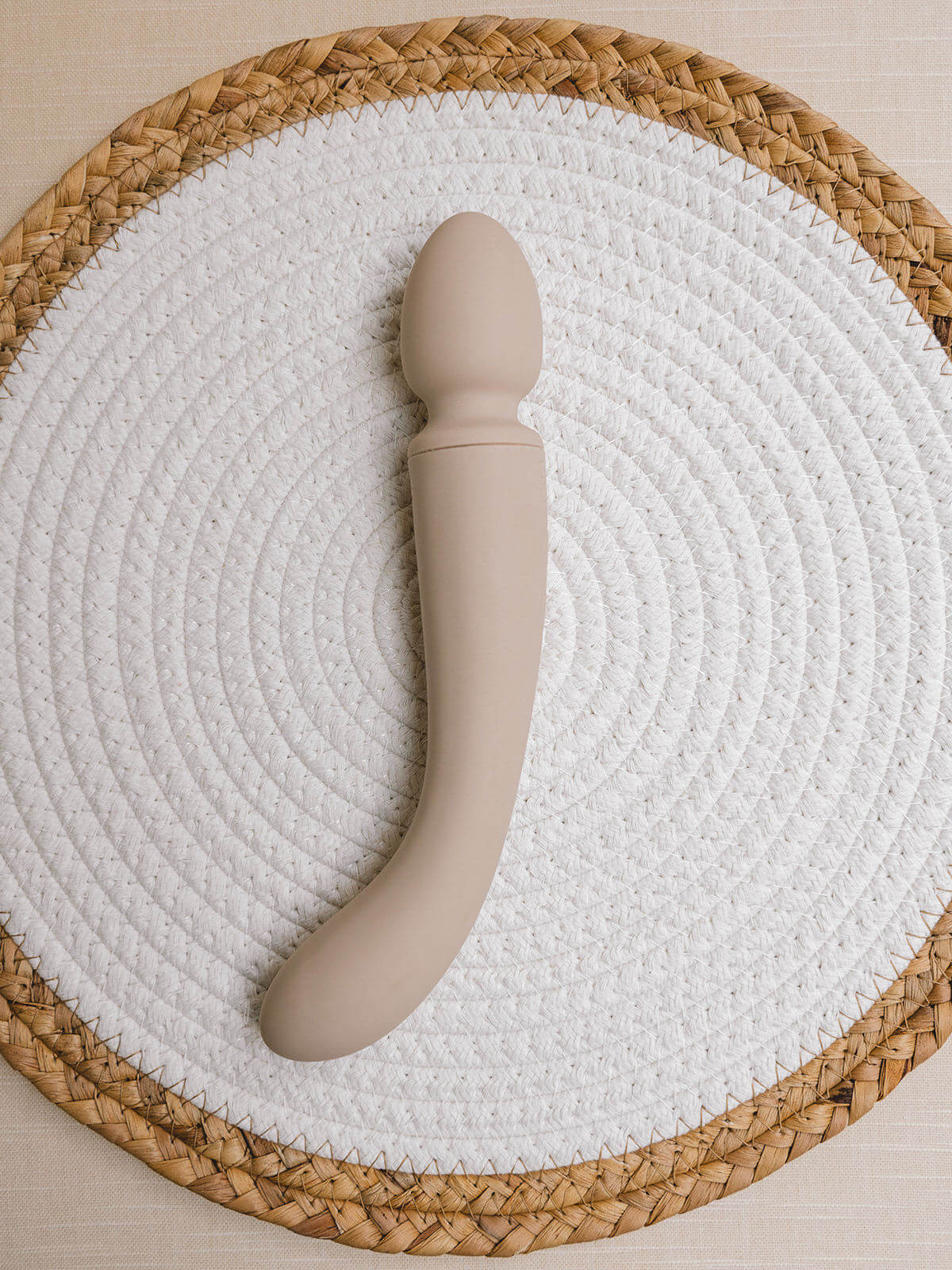 Dual-ended wand vibrator and G-spot vibrating dildo. Sleek design is crafted from an ocean plastic body coated in a buttery soft layer of sanitary grade silicone.