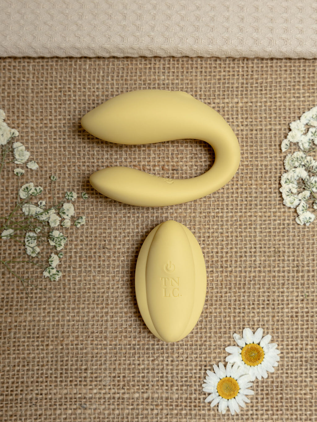 Dual G-Spot & Clitoral Vibrator with Remote Cistus is a remote controlled (remote included) U-shaped vibrator with dual vibrating motors (one at each end), it’s crafted with a recycled ocean plastic internal body dressed in a buttery smooth silicone casing, which comes in a rather dreamy creamy yellow hue.